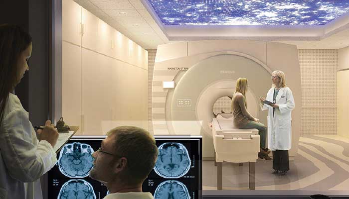 A medical provider talking to a patient outside a scanner