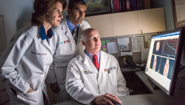 Bone and joint disease specialists from Brigham and Women’s Hospital look at test results.